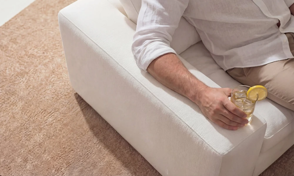 What causes yellowing on light-coloured fabric sofas?